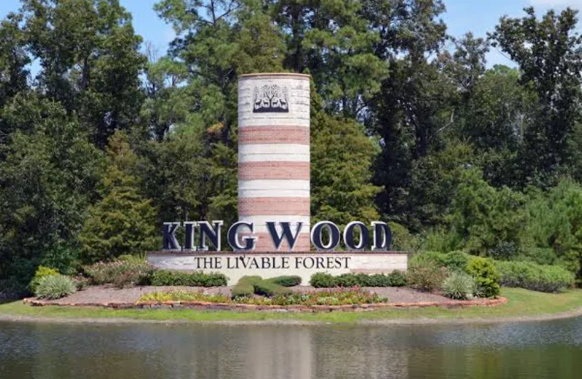 Kingwood 'The Livable Forest' monument sign on the water in Kingwood, Texas