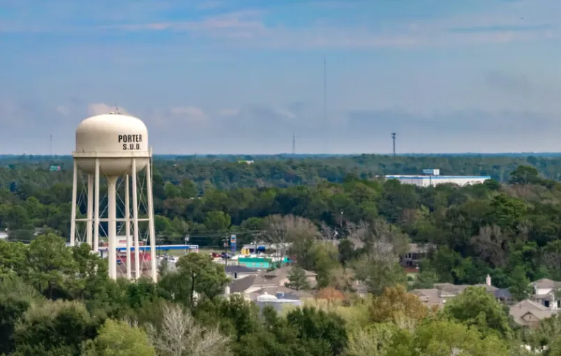 Porter SUD water tower above the treetops in Porter, Texas